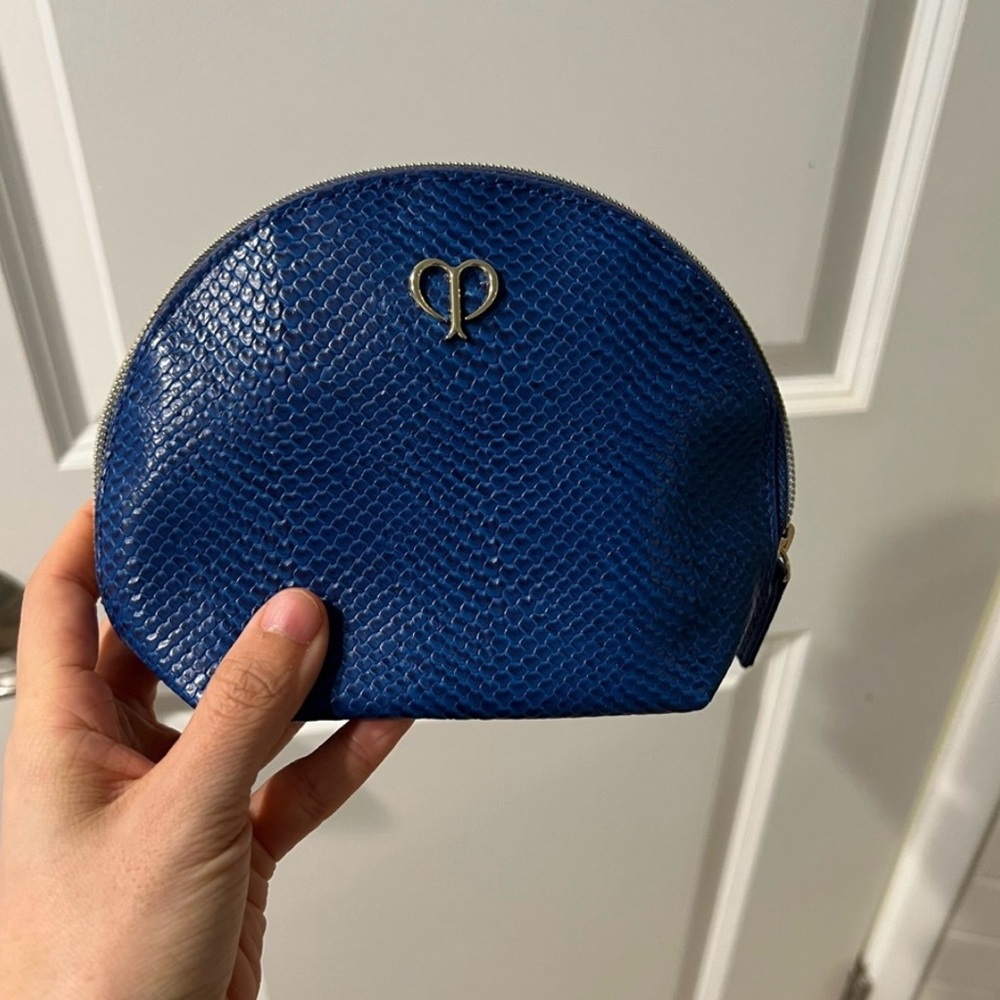 New cle de peau Navy blue in faux reptile skin, makeup bag, size small.